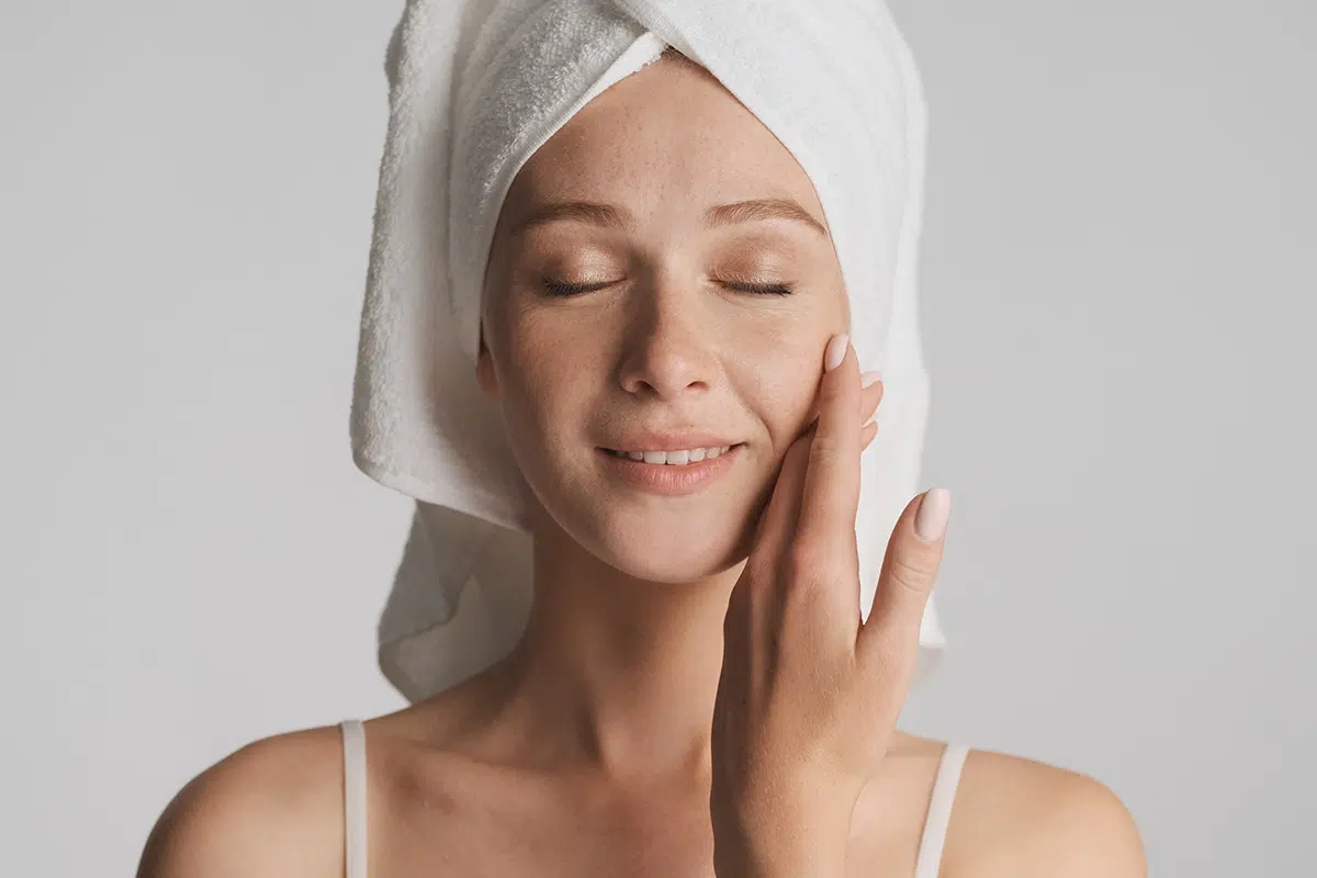 beautiful girl with smooth skin and towel on head