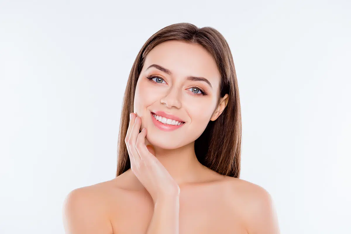 beautiful tender cute pure girl touching her smooth soft flawless perfect skin