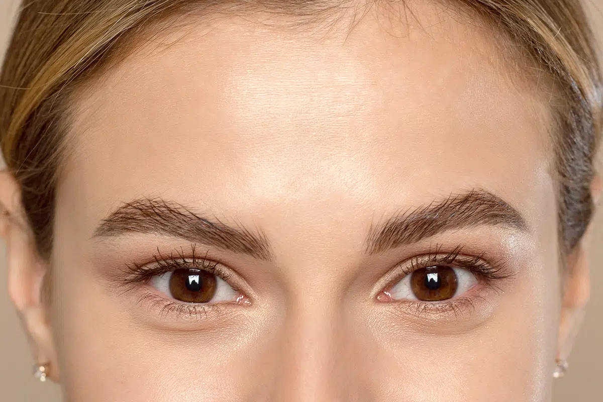 close up of the eyes and forehead of a lovely young woman
