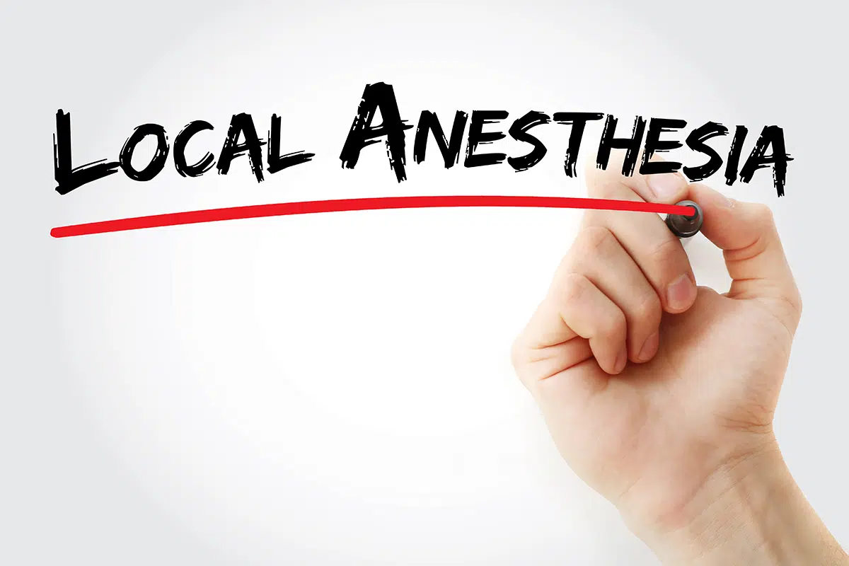 hand writing local anesthesia with marker