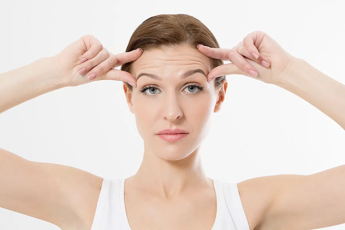woman face with wrinkles on the brow area