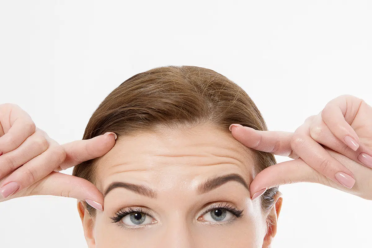 woman face with wrinkles on the forehead