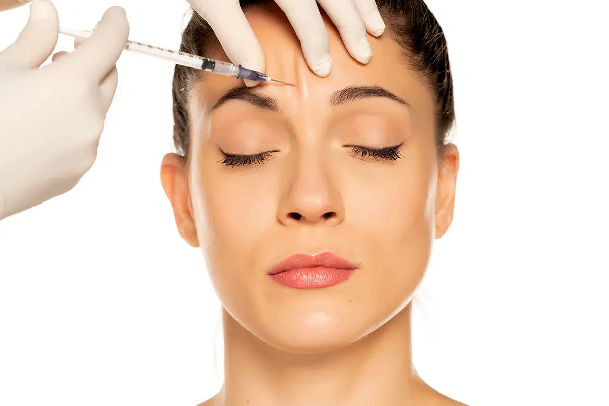 young beautiful woman on a face filler injection procedure