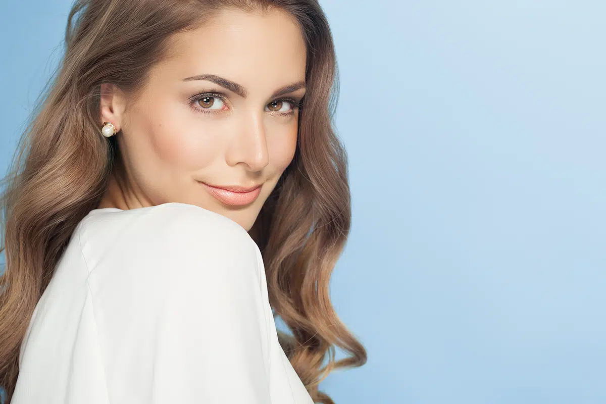 young woman over blue background